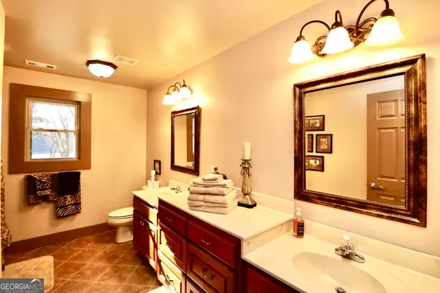 a bedroom with a bed and a fireplace