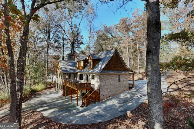 a view of a house with backyard porch and sitting area