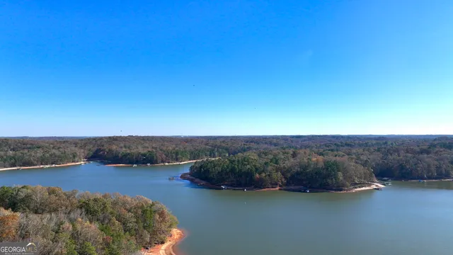 a view of a lake with mountain in the background