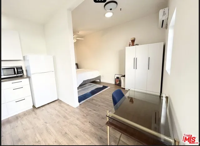a kitchen with a sink a stove and cabinets