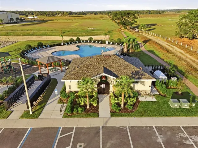 an aerial view of residential building and ocean view