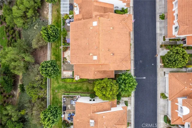 an aerial view of a residential apartment building with a yard