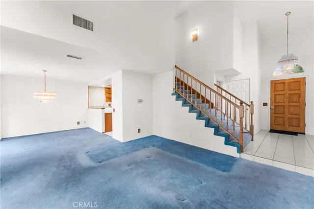a view of an empty room with stairs