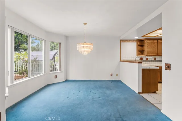a view of kitchen with stove top oven