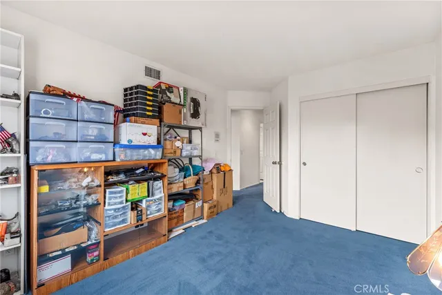 a view of a room with toys and wooden floor