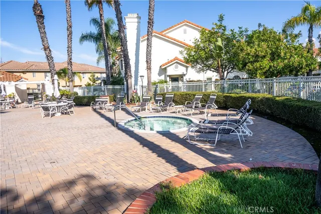 a swimming pool with outdoor seating and yard