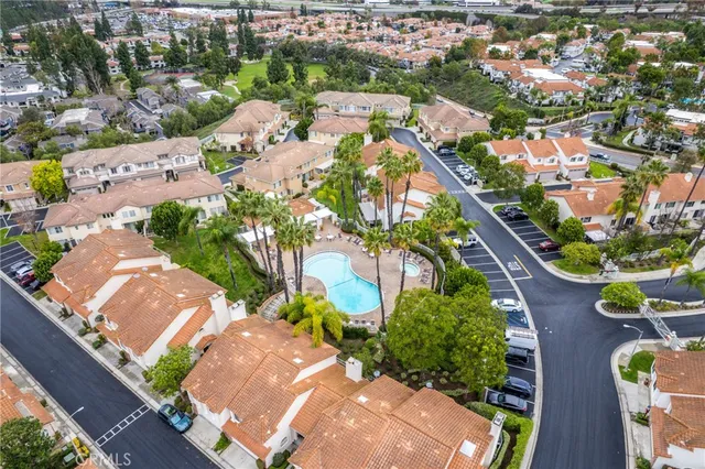 an aerial view of residential houses with outdoor space
