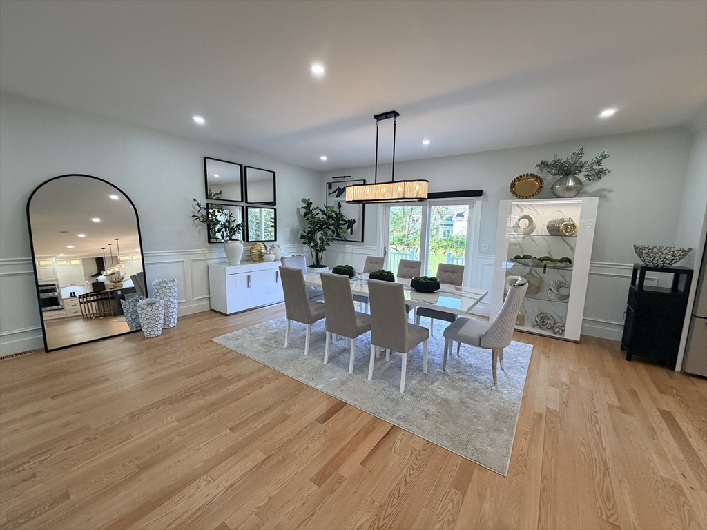 6 Rivendell Lane Millis, MA 02054 - Photo 7 of 33 a view of a dining room with furniture and wooden floor