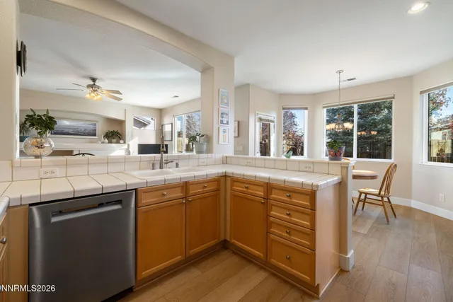a kitchen with stainless steel appliances granite countertop a stove and a sink