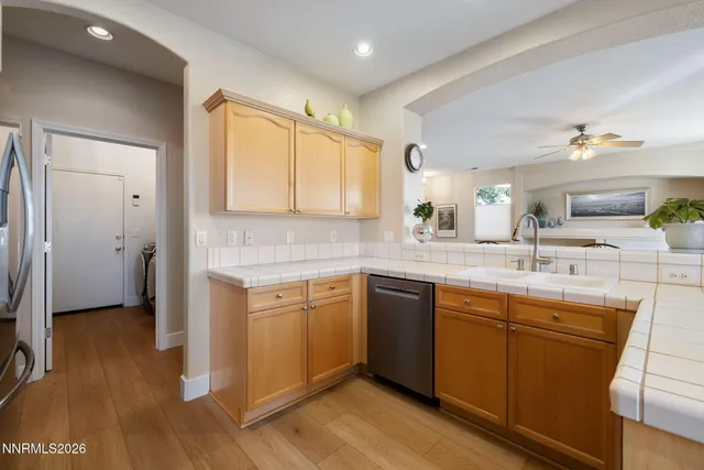 a spacious bathroom with a double vanity sink a mirror and a shower