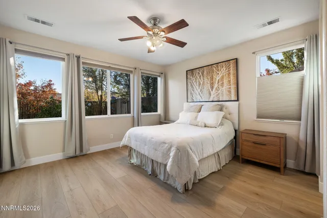a bedroom with a large bed and a window