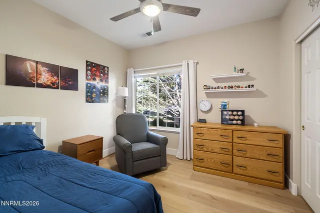 a bedroom with furniture and window