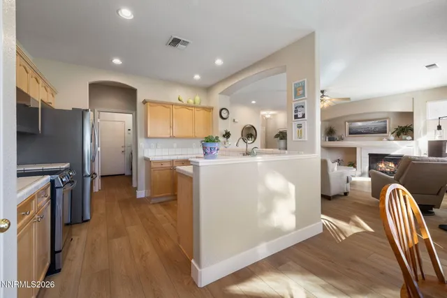 a kitchen with stainless steel appliances granite countertop a refrigerator stove microwave and sink