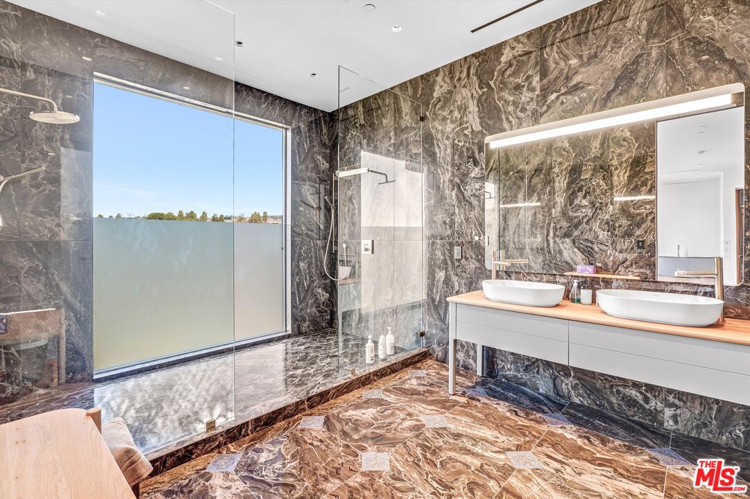 9400 Readcrest Drive Beverly Hills, CA 90210 - Photo 16 of 33 a large white room with a large window and a bed