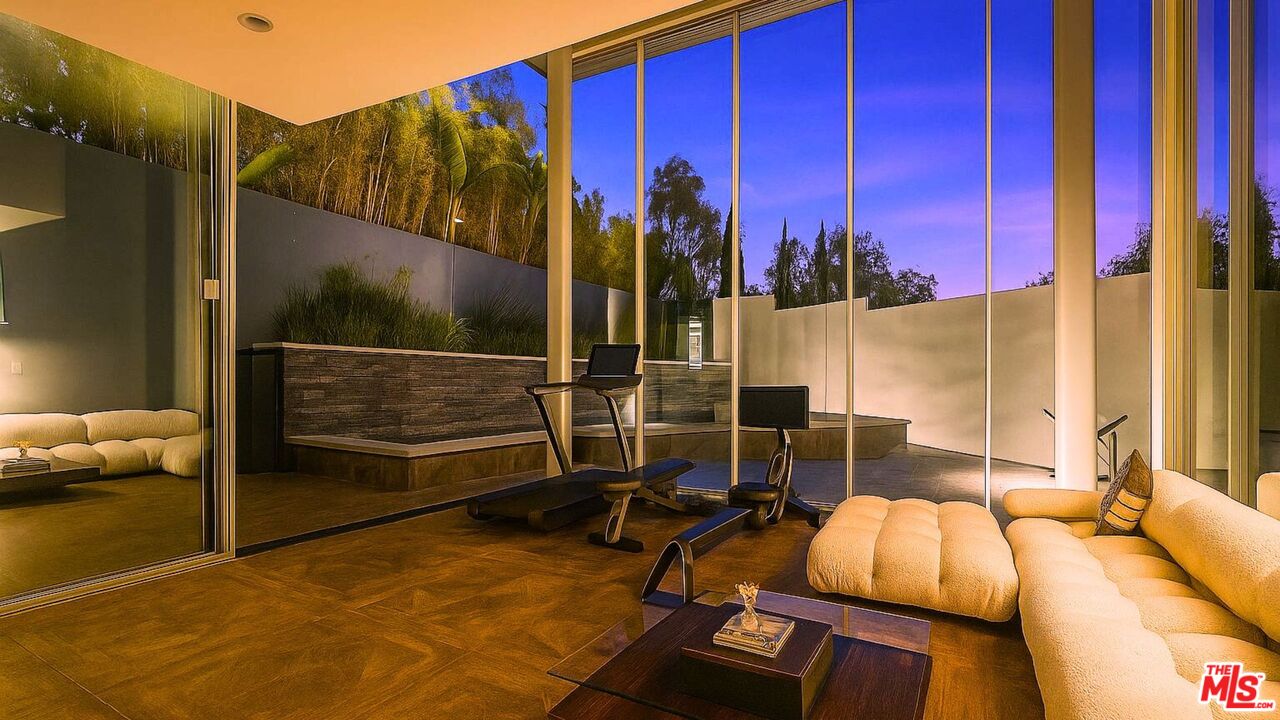 9400 Readcrest Drive Beverly Hills, CA 90210 - Photo 29 of 33 a view of a balcony with chairs and a potted plant