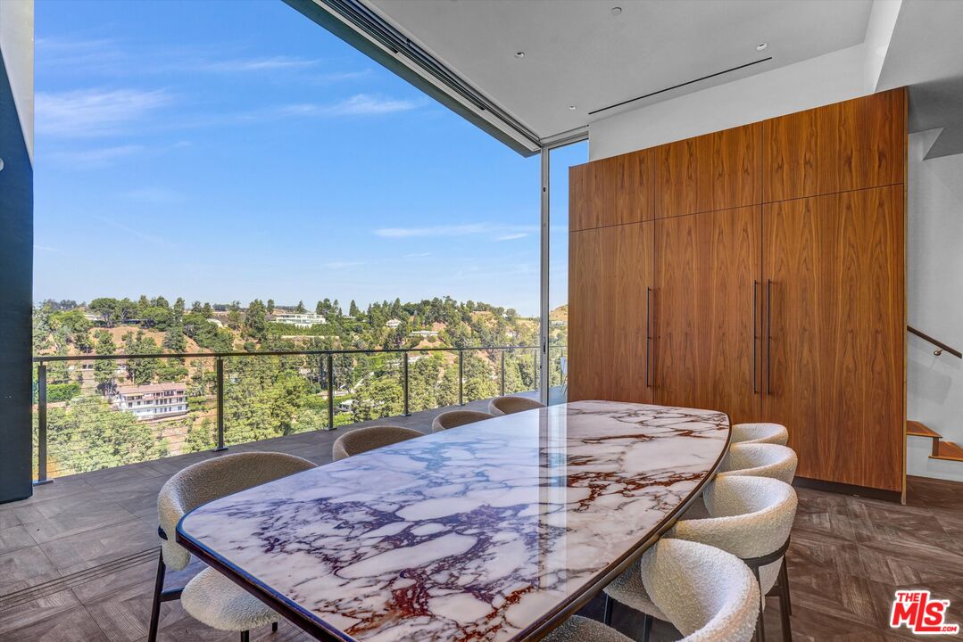 9400 Readcrest Drive Beverly Hills, CA 90210 - Photo 6 of 33 a view of a livingroom with furniture window and wooden floor