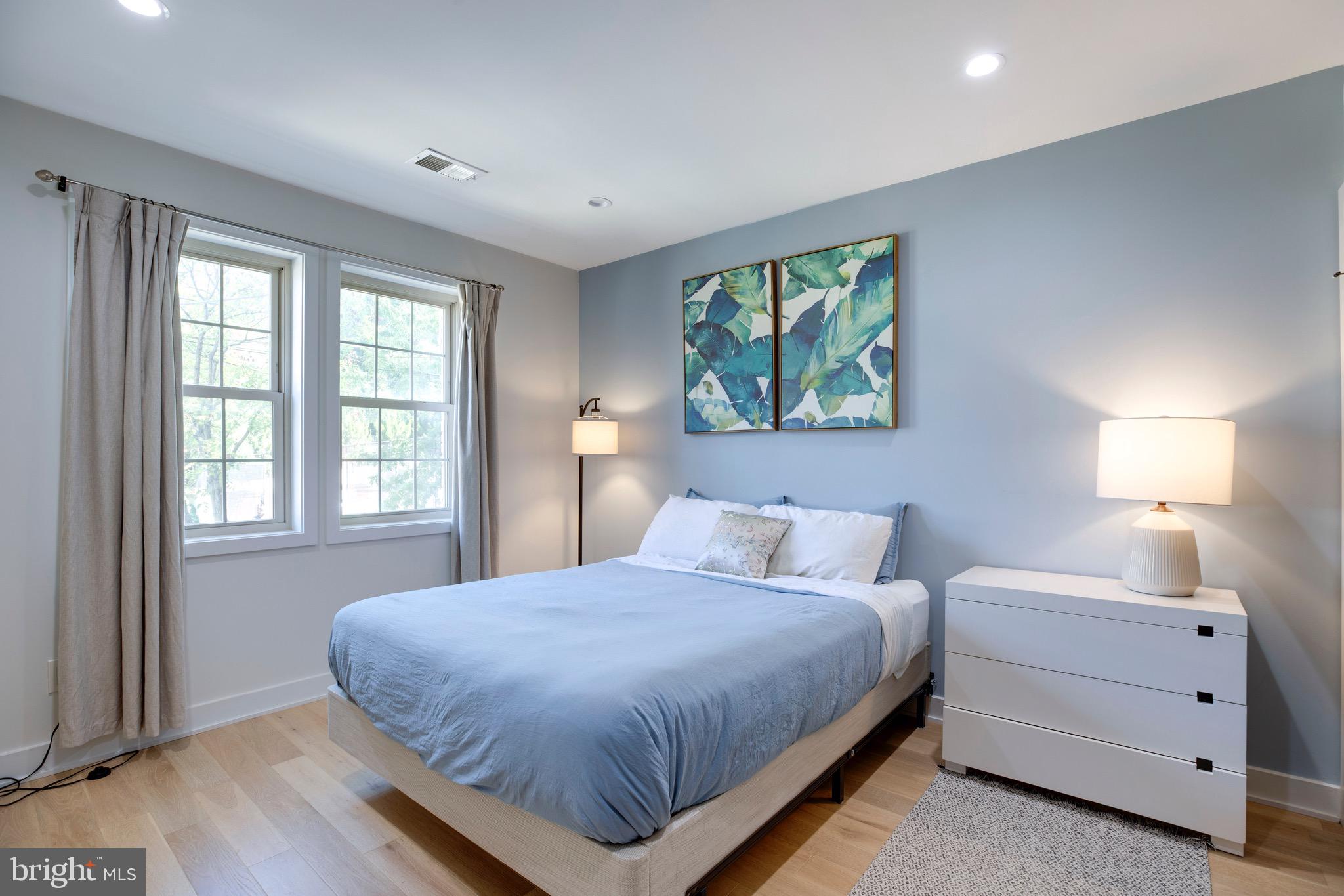 2625 3rd Street Northeast, Unit 203 Washington, DC 20002 - Photo 16 of 25 a bedroom with a bed and a large window