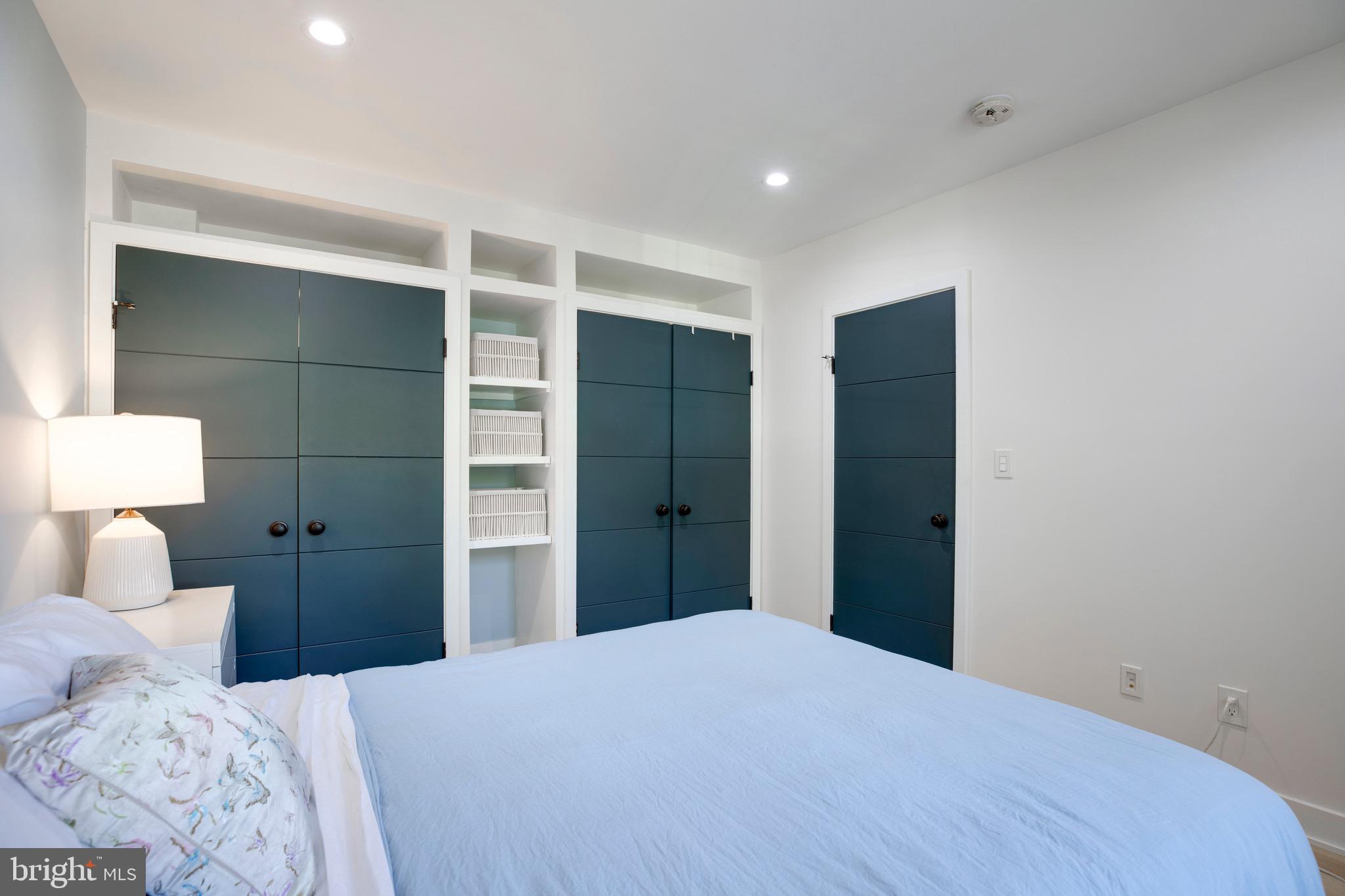 2625 3rd Street Northeast, Unit 203 Washington, DC 20002 - Photo 18 of 25 a bedroom with a bed and a lamp