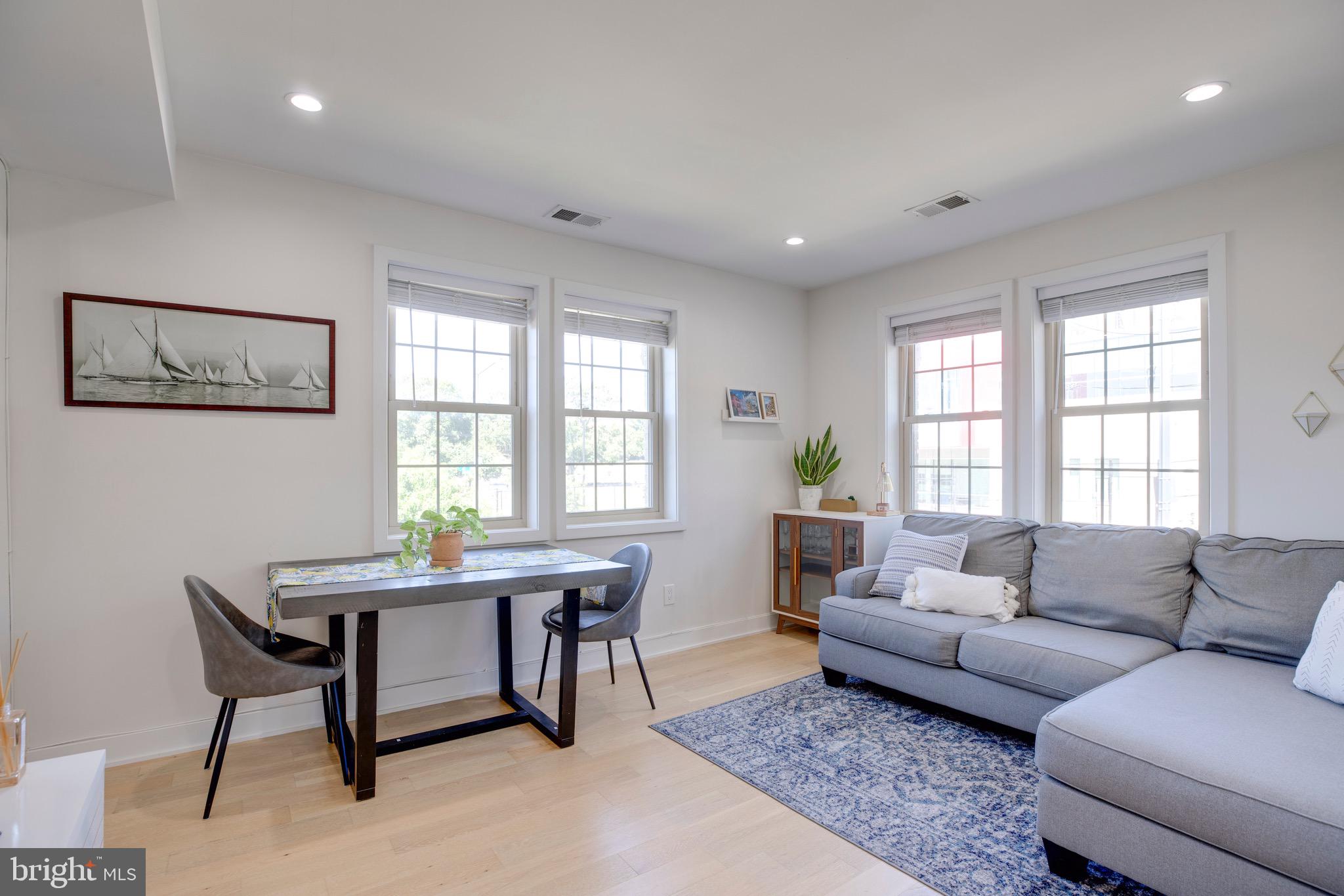 2625 3rd Street Northeast, Unit 203 Washington, DC 20002 - Photo 8 of 25 a living room with furniture and windows
