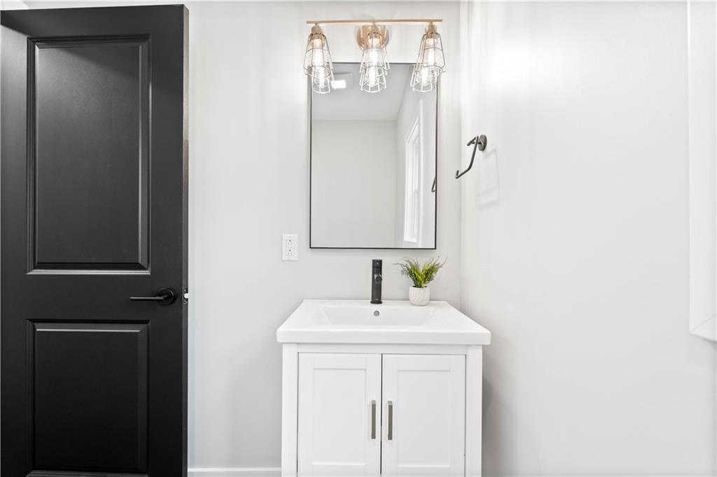 710 Cedar Avenue Pittsburgh, PA 15212 - Photo 6 of 25 a bathroom with a sink and a mirror