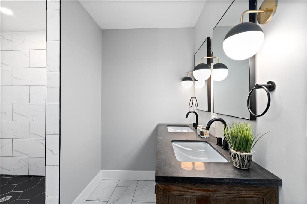 710 Cedar Avenue Pittsburgh, PA 15212 - Photo 10 of 25 a bathroom with a sink and a potted plant