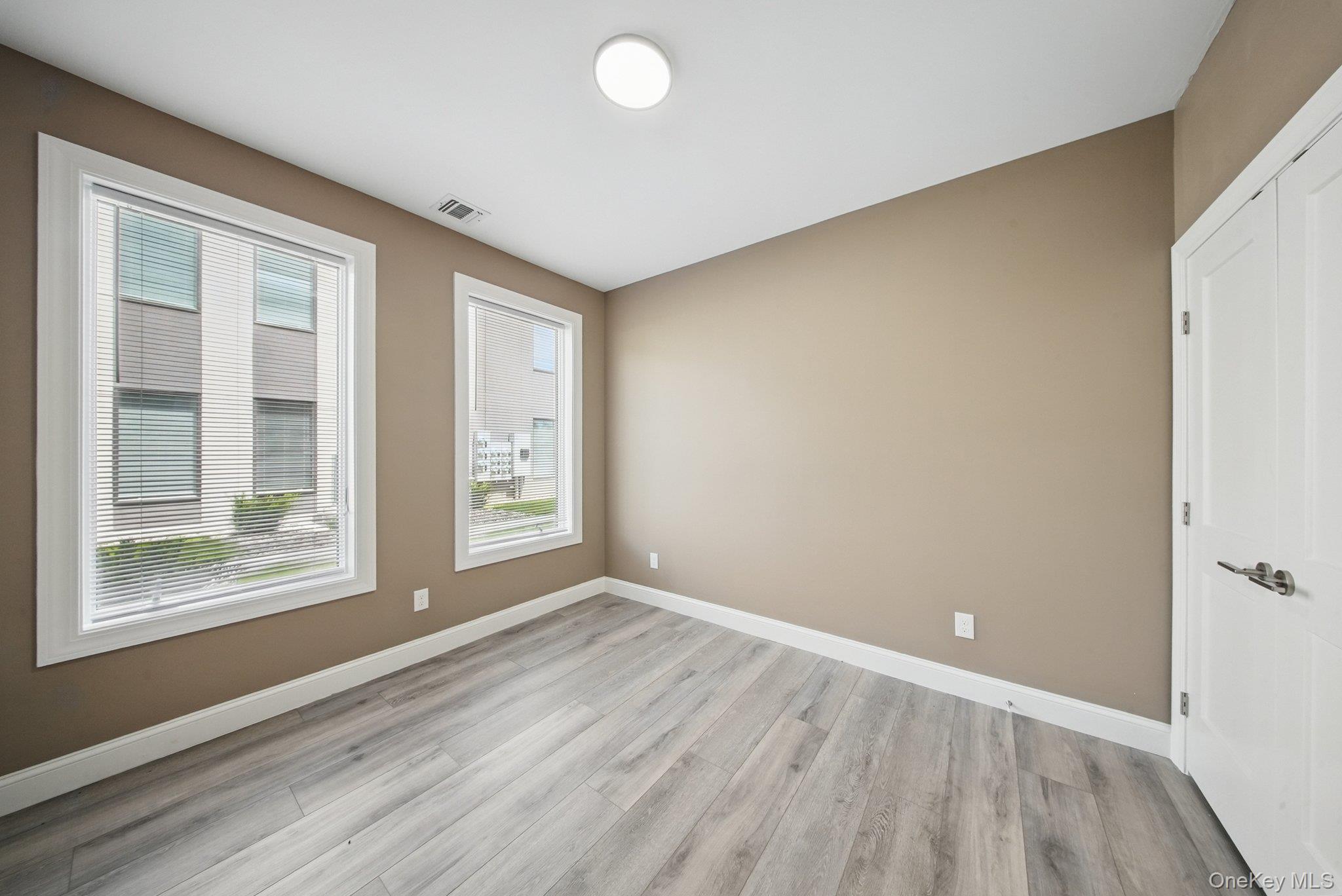 6 Giada Lane, Unit 6 Middletown, NY 10940 - Photo 15 of 29 a view of an empty room with wooden floor and a window