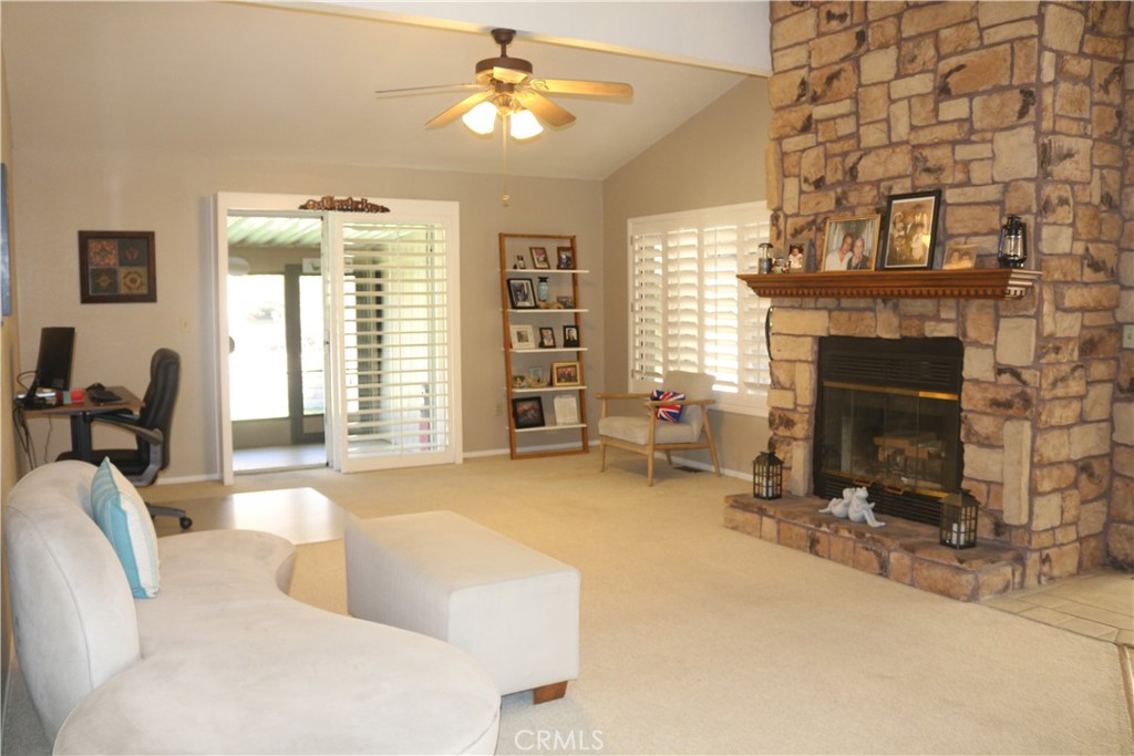 9453 Sharon Way Calimesa, CA 92320 - Photo 15 of 15 a living room with furniture and a fireplace