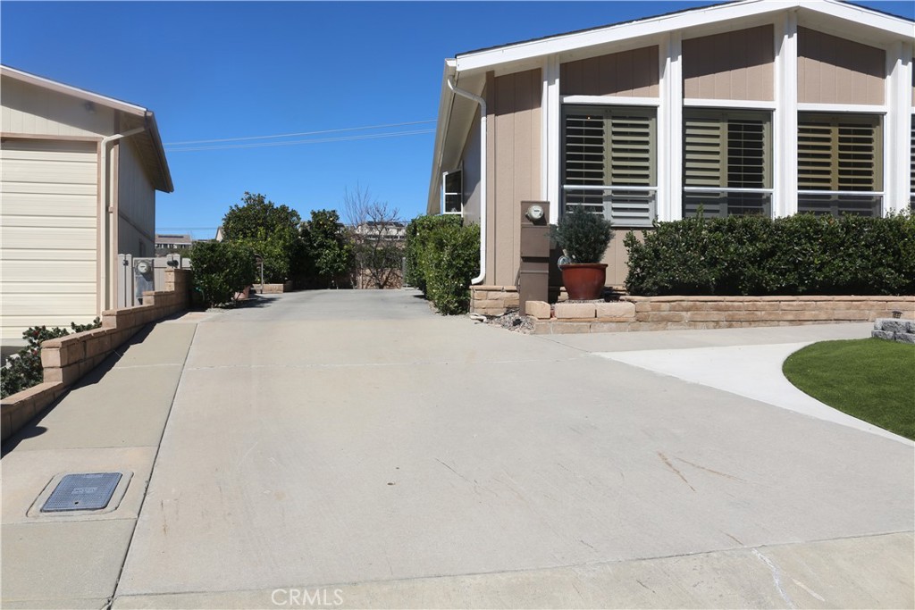 9453 Sharon Way Calimesa, CA 92320 - Photo 3 of 15 a front view of a house with a yard
