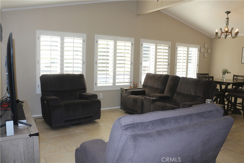 9453 Sharon Way Calimesa, CA 92320 - Photo 10 of 15 a living room with furniture and a large window
