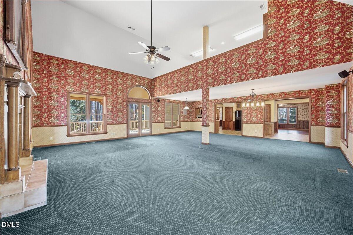 13616 New Light Road Raleigh, NC 27614 - Photo 14 of 60 a view of a room with large windows