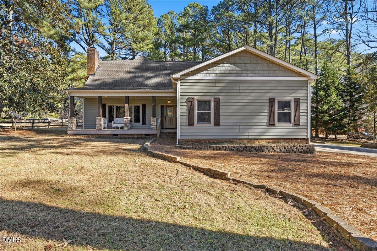 13616 New Light Road Raleigh, NC 27614 - Photo 2 of 60 a front view of a house with a yard