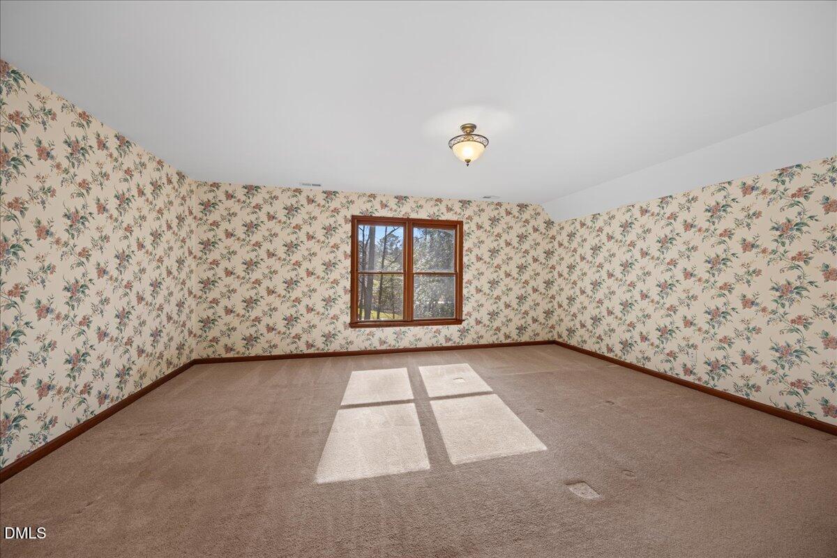 13616 New Light Road Raleigh, NC 27614 - Photo 24 of 60 a view of an empty room with windows