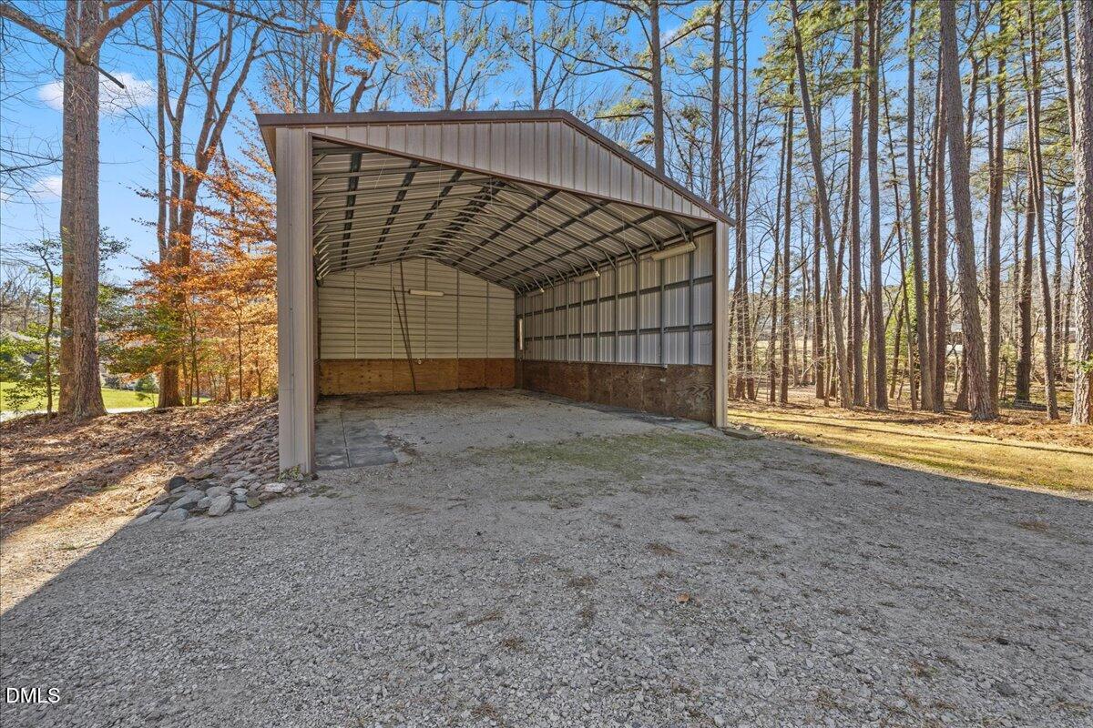 13616 New Light Road Raleigh, NC 27614 - Photo 43 of 60 a view of a house with an empty space and wooden fence