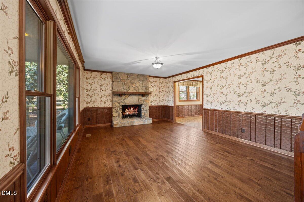 13616 New Light Road Raleigh, NC 27614 - Photo 7 of 60 a living room with furniture and a wooden floor
