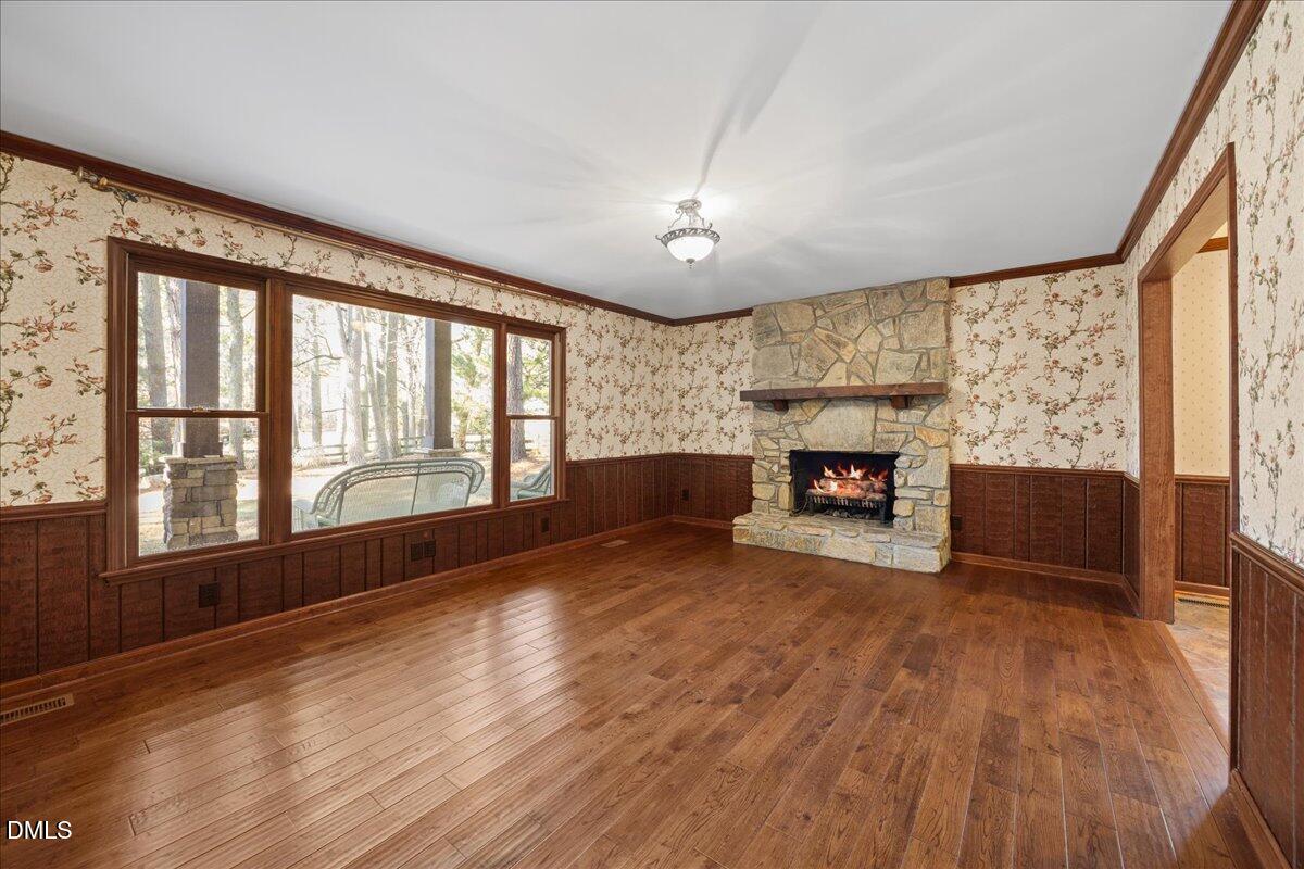 13616 New Light Road Raleigh, NC 27614 - Photo 8 of 60 a view of an empty room with a fireplace and a window
