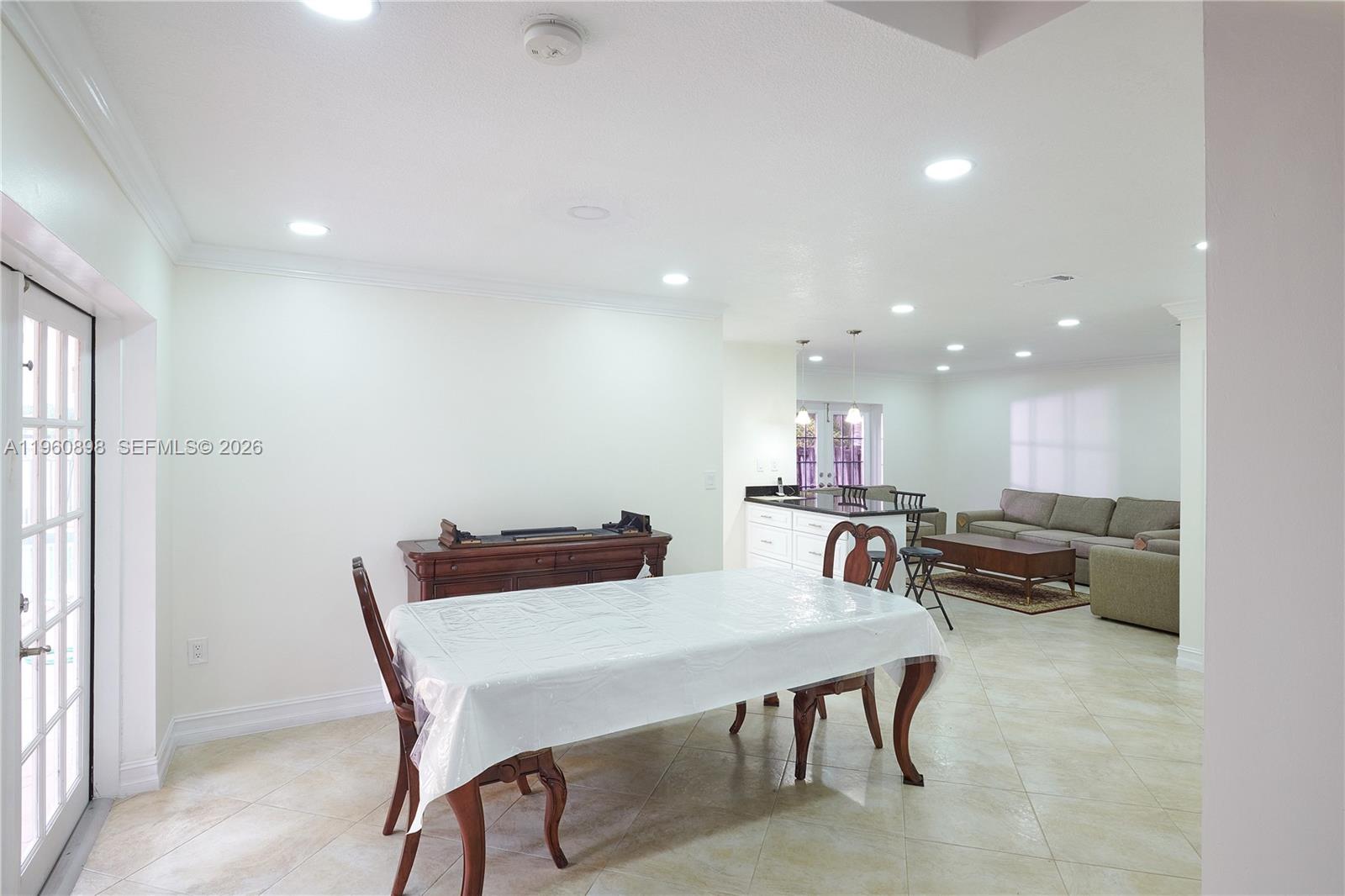 20030 Northwest 83rd Court Hialeah, FL 33015 - Photo 13 of 33 a view of a dining room with furniture