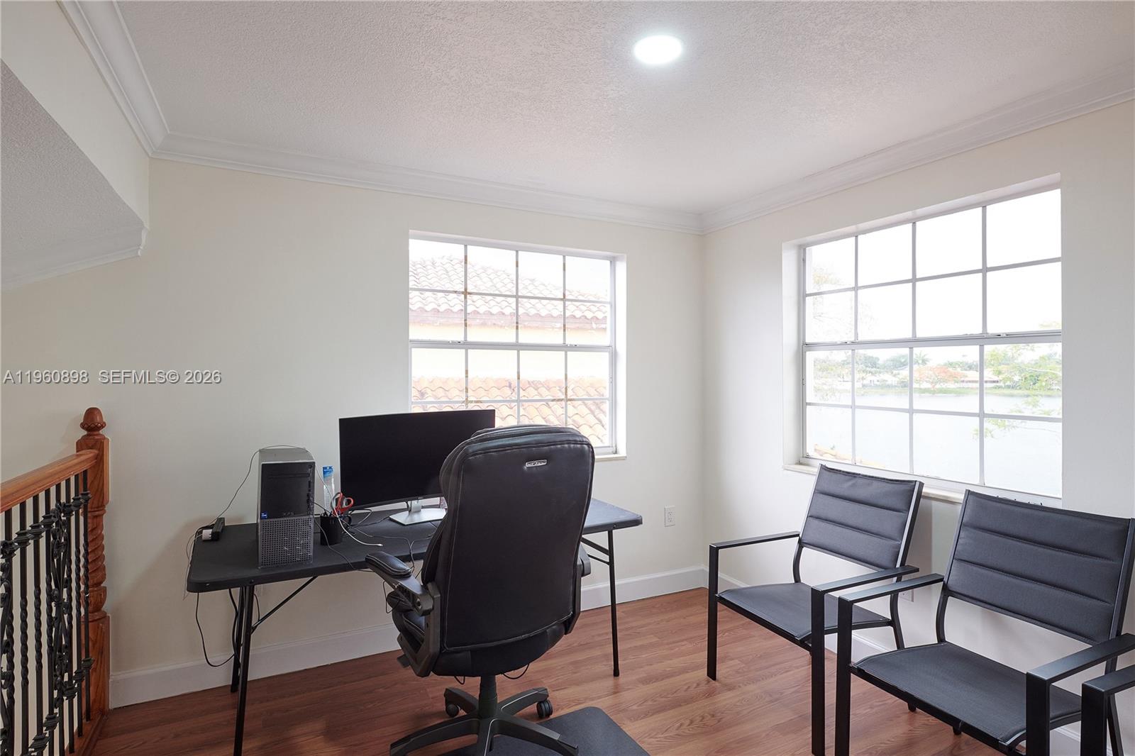 20030 Northwest 83rd Court Hialeah, FL 33015 - Photo 14 of 33 a view of a workspace with furniture and a window