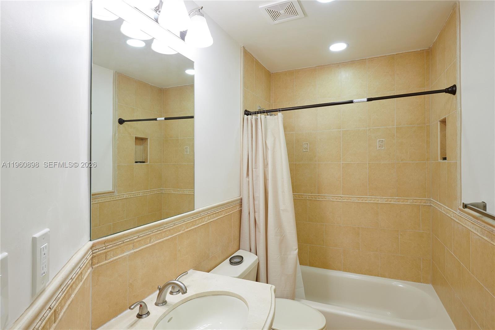 20030 Northwest 83rd Court Hialeah, FL 33015 - Photo 17 of 33 a bathroom with a shower and a sink