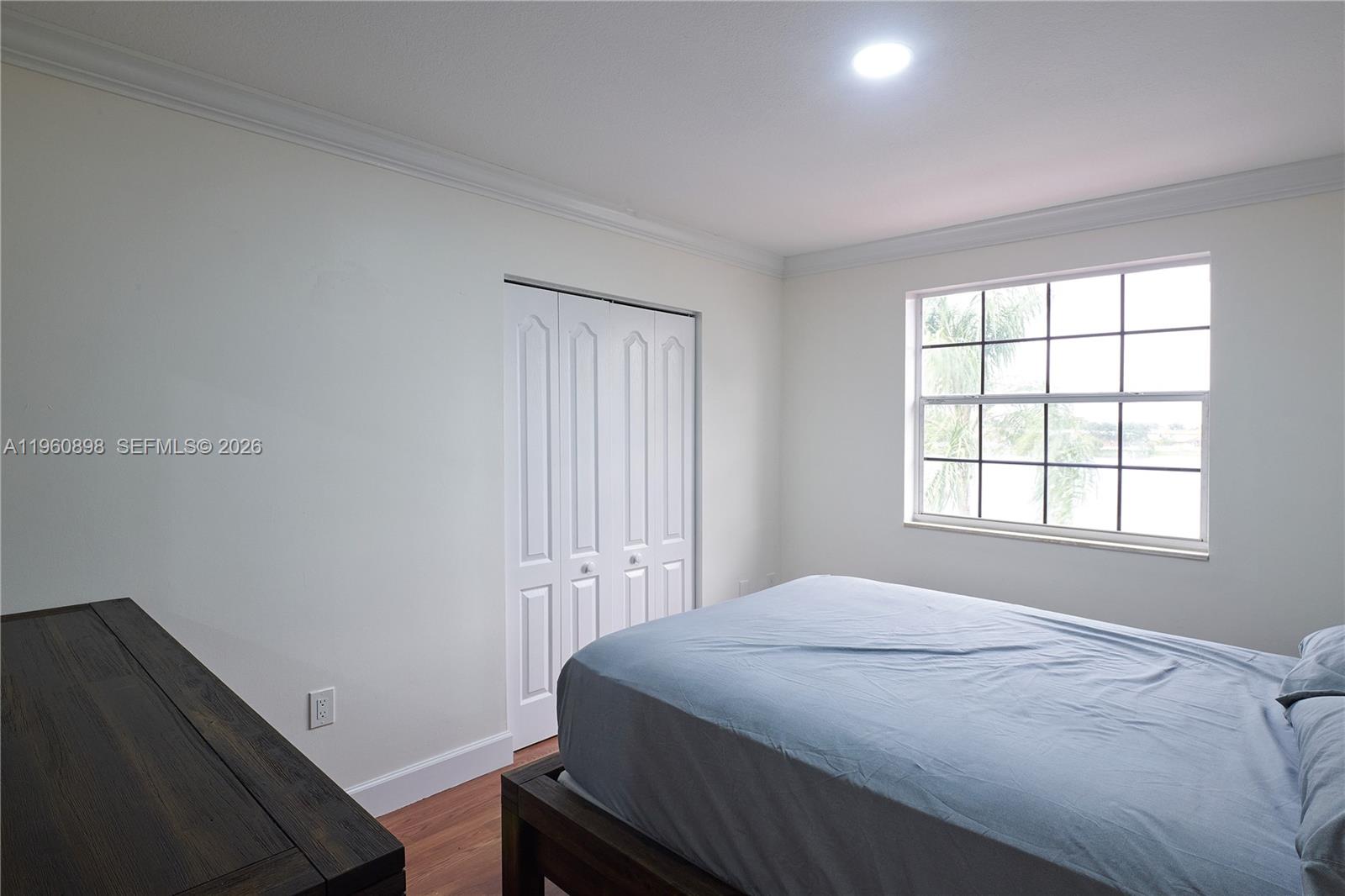 20030 Northwest 83rd Court Hialeah, FL 33015 - Photo 18 of 33 a bedroom with a bed and a window