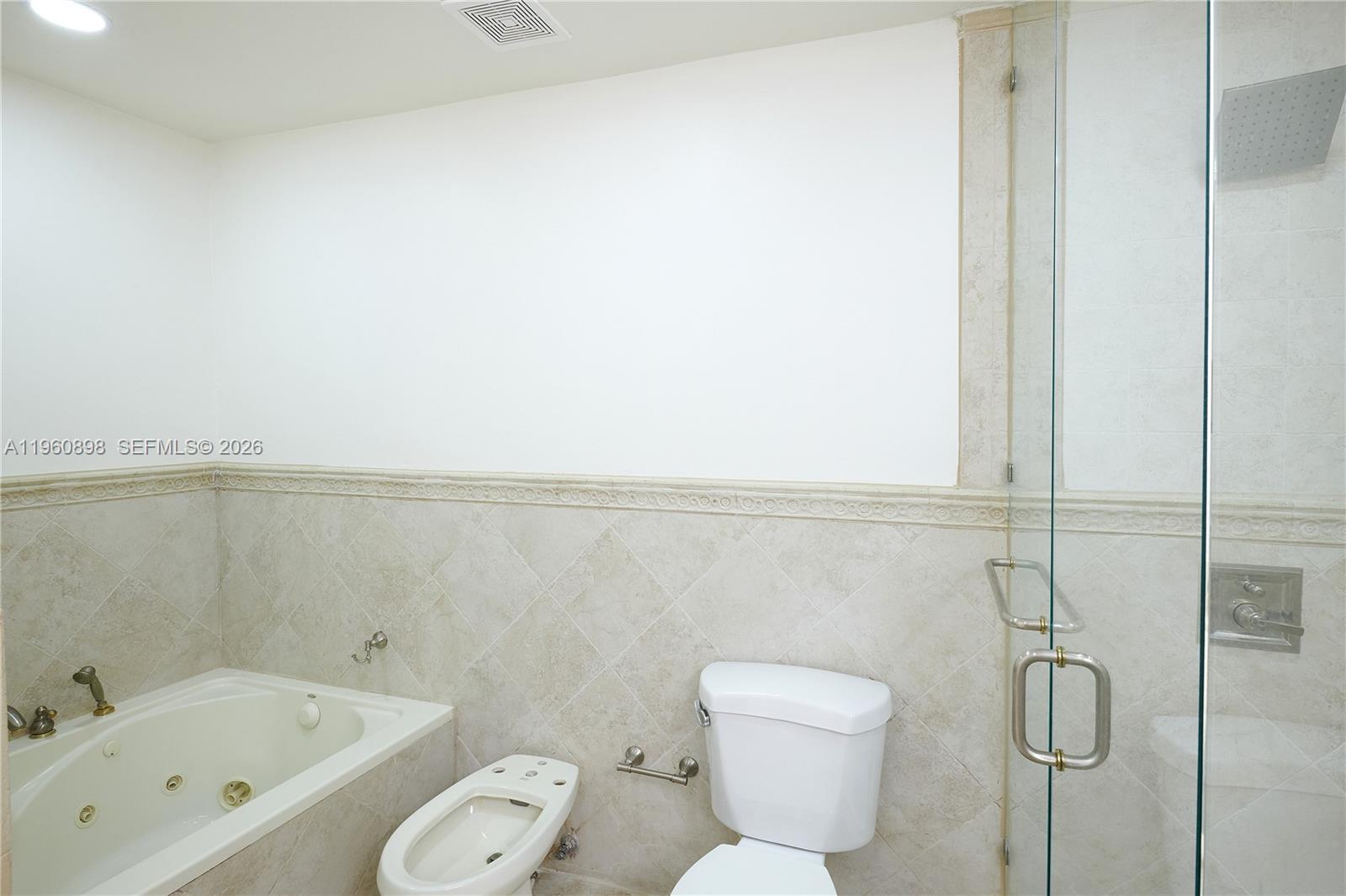 20030 Northwest 83rd Court Hialeah, FL 33015 - Photo 21 of 33 a bathroom with a toilet and a bathtub