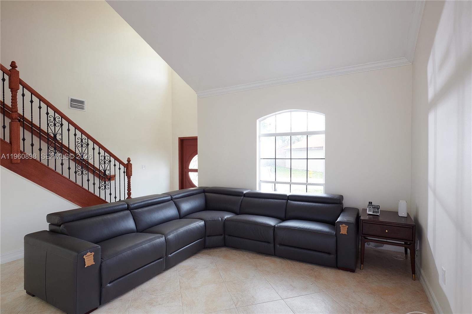 20030 Northwest 83rd Court Hialeah, FL 33015 - Photo 4 of 33 a living room with furniture and a window