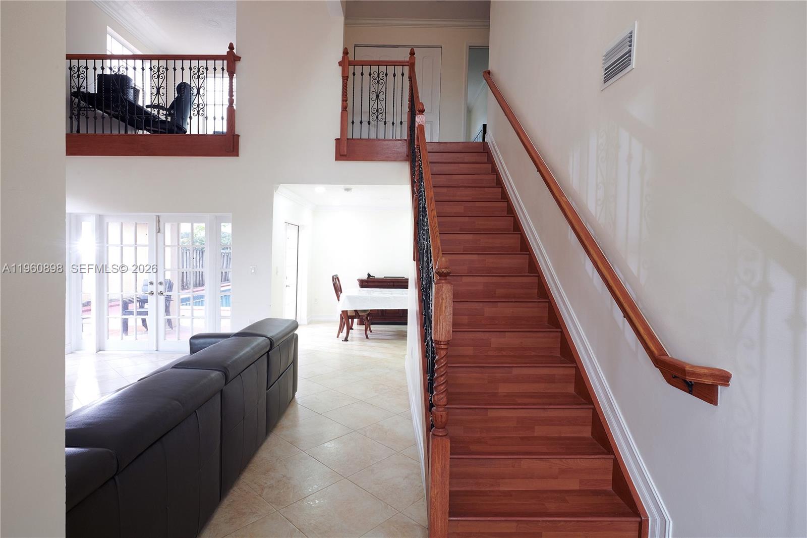 20030 Northwest 83rd Court Hialeah, FL 33015 - Photo 5 of 33 a living room with furniture and a stair