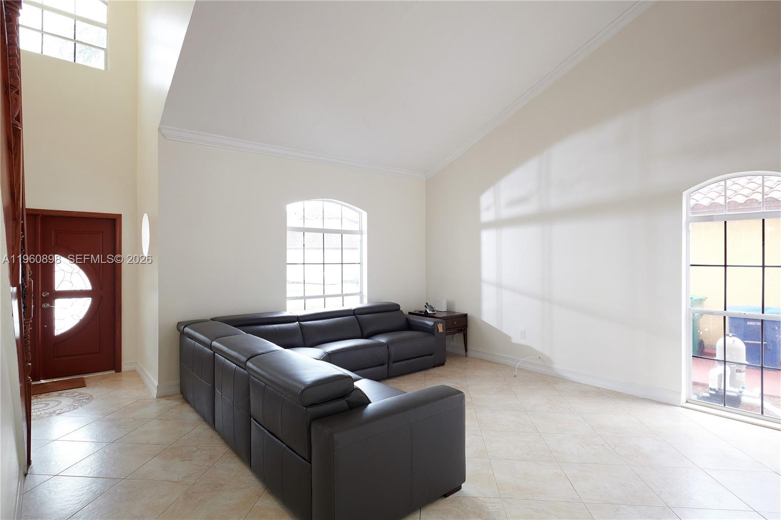 20030 Northwest 83rd Court Hialeah, FL 33015 - Photo 6 of 33 a living room with furniture and a window