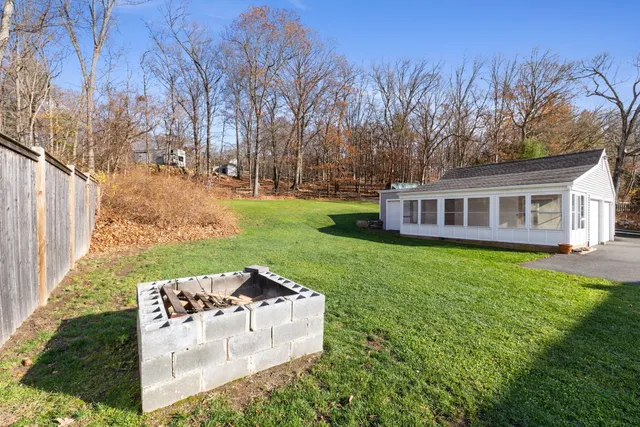 a view of a house with swimming pool and a yard