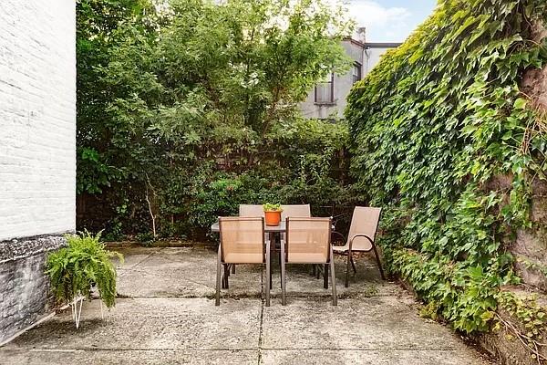 68 Stratford Road, Unit 7 Brooklyn, NY 11218 - Photo 12 of 13 a lawn chairs sitting in a backyard
