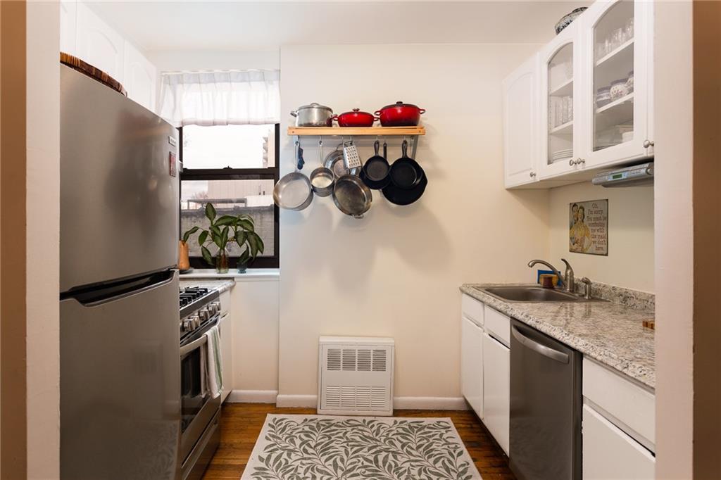 68 Stratford Road, Unit 7 Brooklyn, NY 11218 - Photo 2 of 13 a kitchen with a refrigerator and a sink