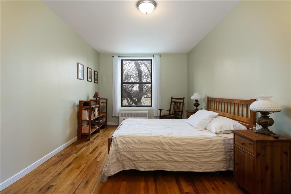 68 Stratford Road, Unit 7 Brooklyn, NY 11218 - Photo 3 of 13 a bedroom with a bed and a window