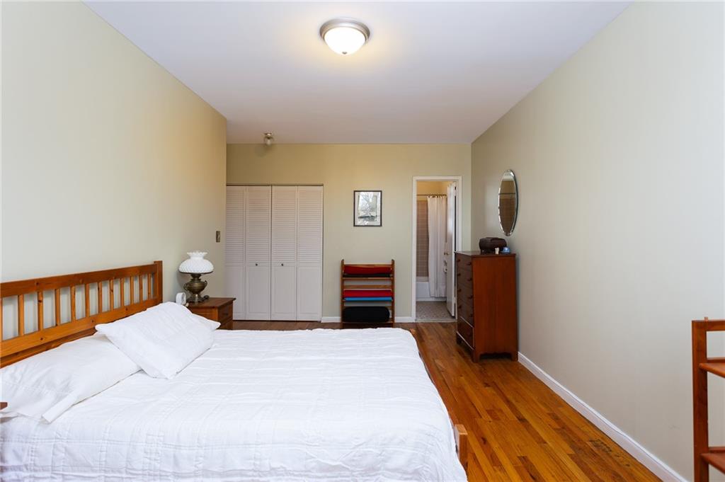 68 Stratford Road, Unit 7 Brooklyn, NY 11218 - Photo 4 of 13 a bedroom with a bed and a tv