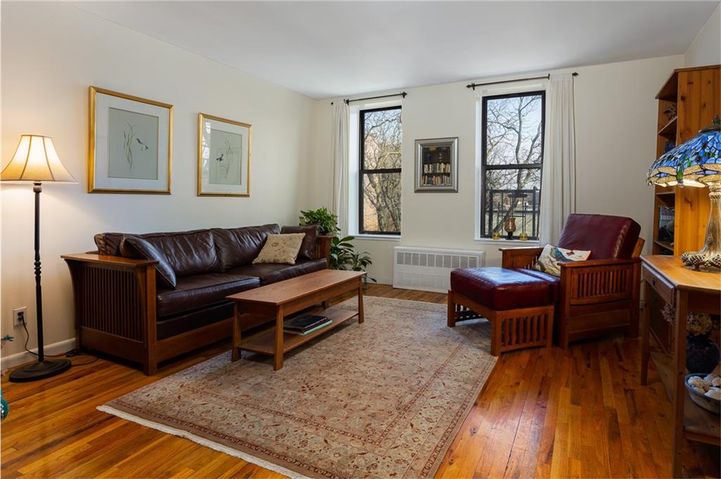 68 Stratford Road, Unit 7 Brooklyn, NY 11218 - Photo 6 of 13 a living room with furniture and a wooden floor