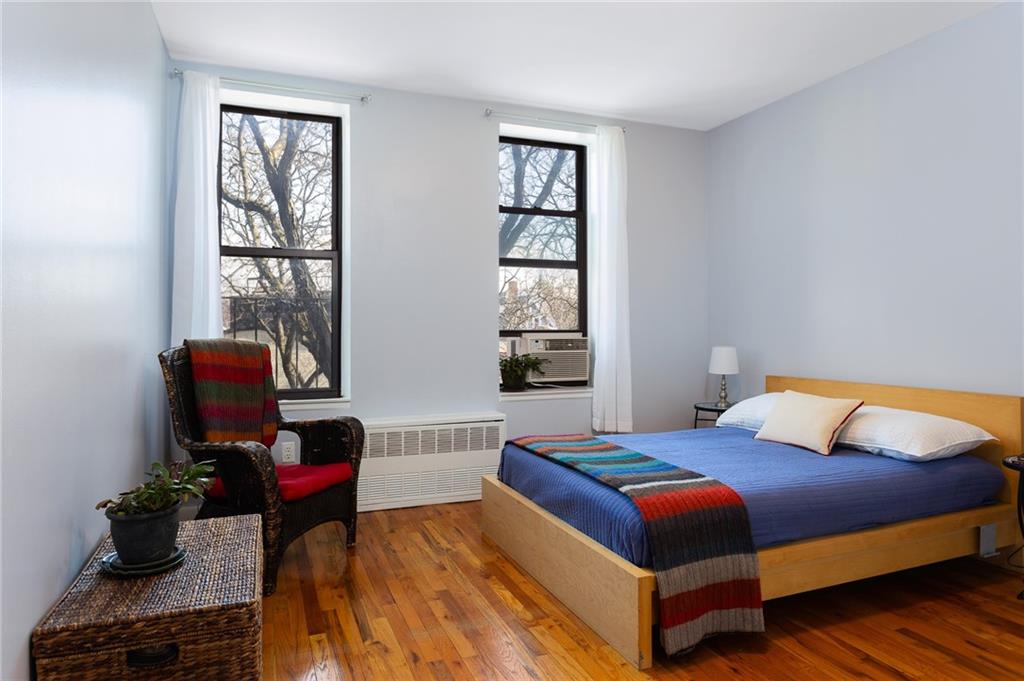 68 Stratford Road, Unit 7 Brooklyn, NY 11218 - Photo 8 of 13 a bedroom with a bed and wooden floor
